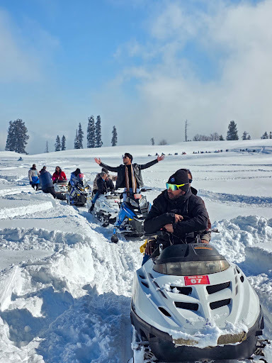 Snowmobiling trails across Gulmarg meadows